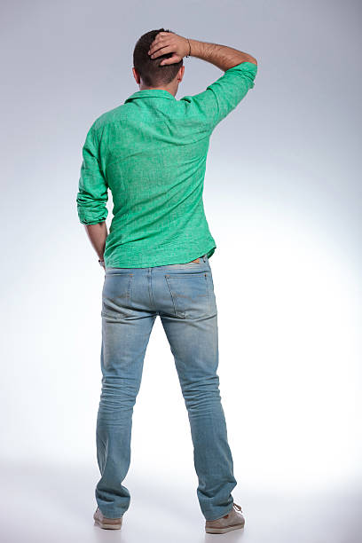 istock back view of a casual man with hand behind head 184904010