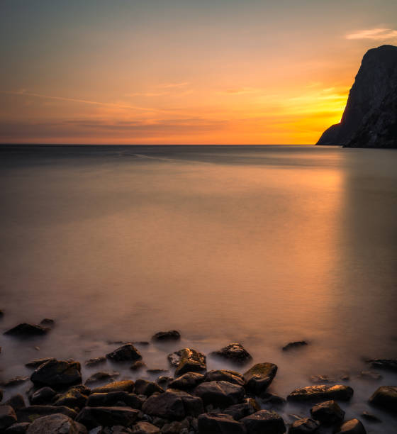 Free Stock Photo of Golden sunset on a serene beach with rocky ...
