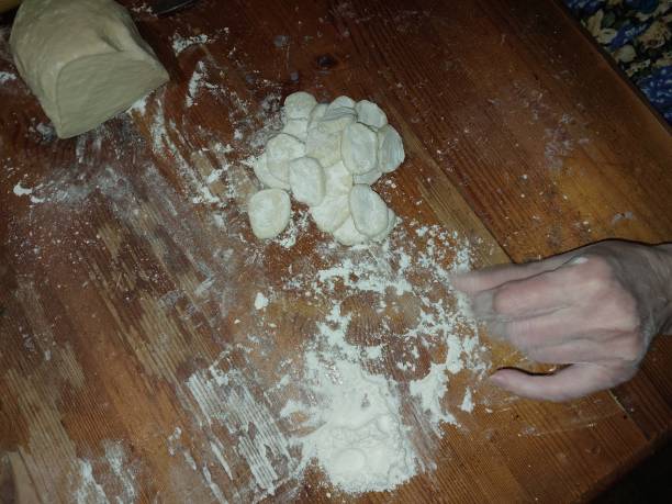 istock Mixing and cutting dough for making flour products 1849074655
