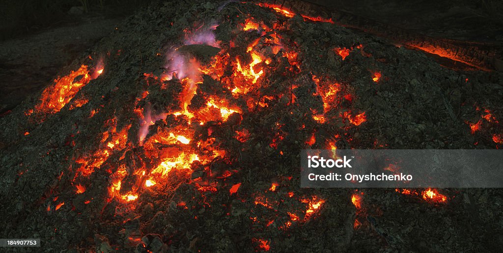 Smoldering fire Smoldering fire at night Bonfire Stock Photo