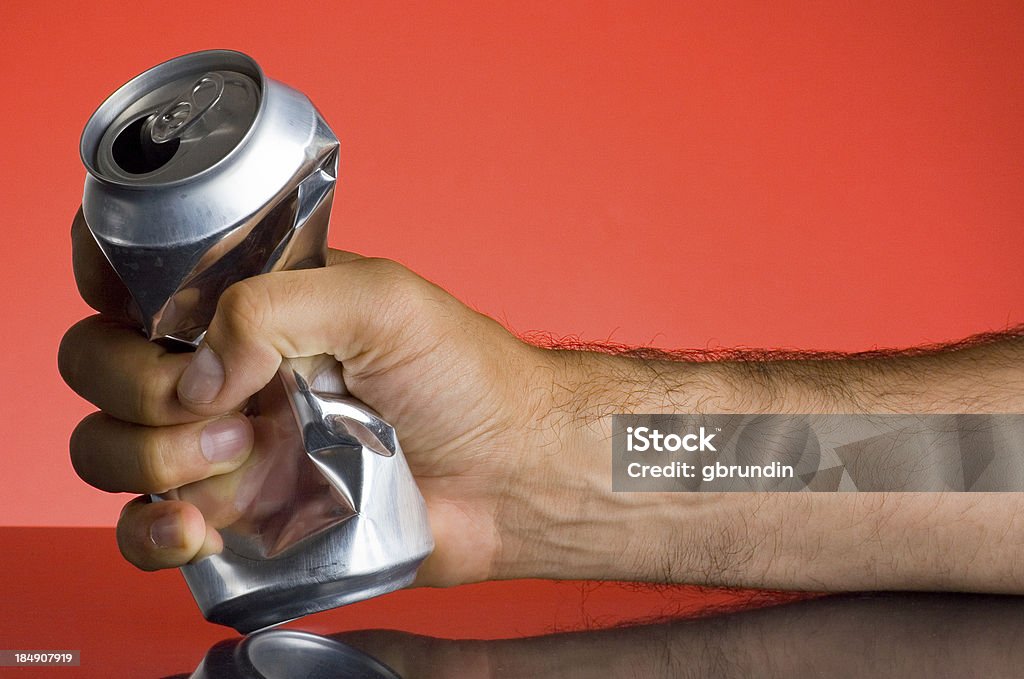 Crushing can A male hand crushing a beer can.Similar from my portfolio: Crushed Stock Photo