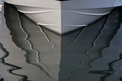 Boat reflection in calm water