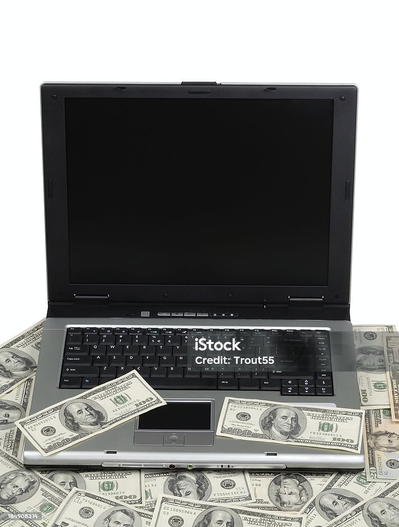Computadora portátil y dólares - Foto de stock de Actividad comercial libre de derechos
