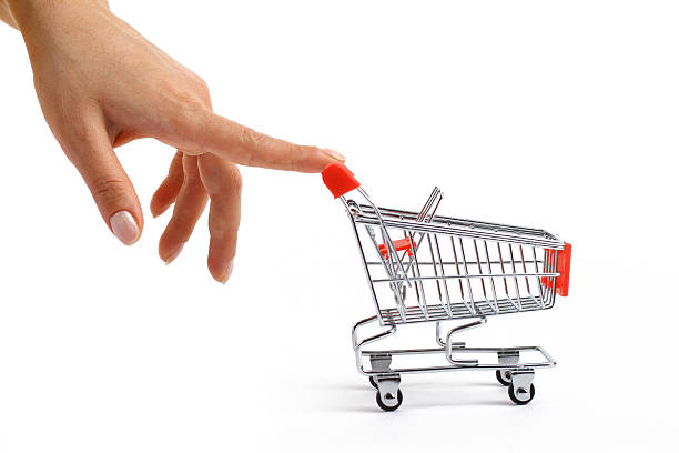 Small shopping cart been pushed stock photo