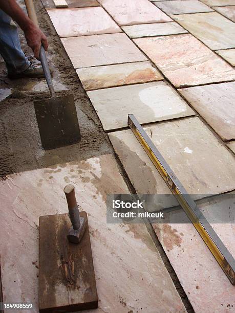 Laying Patio Flag Paving Slabs In Garden Stock Photo - Download Image Now - Construction Industry, Patio, Adult