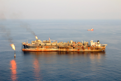 Aerial photo of an FPSO type oil rig off the coast of Africa.