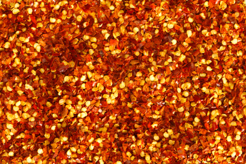 Crushed pepper flakes create this seamless background