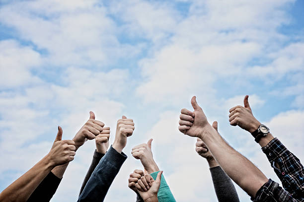 istock Group Of People Thumbs Up Blue Sky.Copy Space 184909069