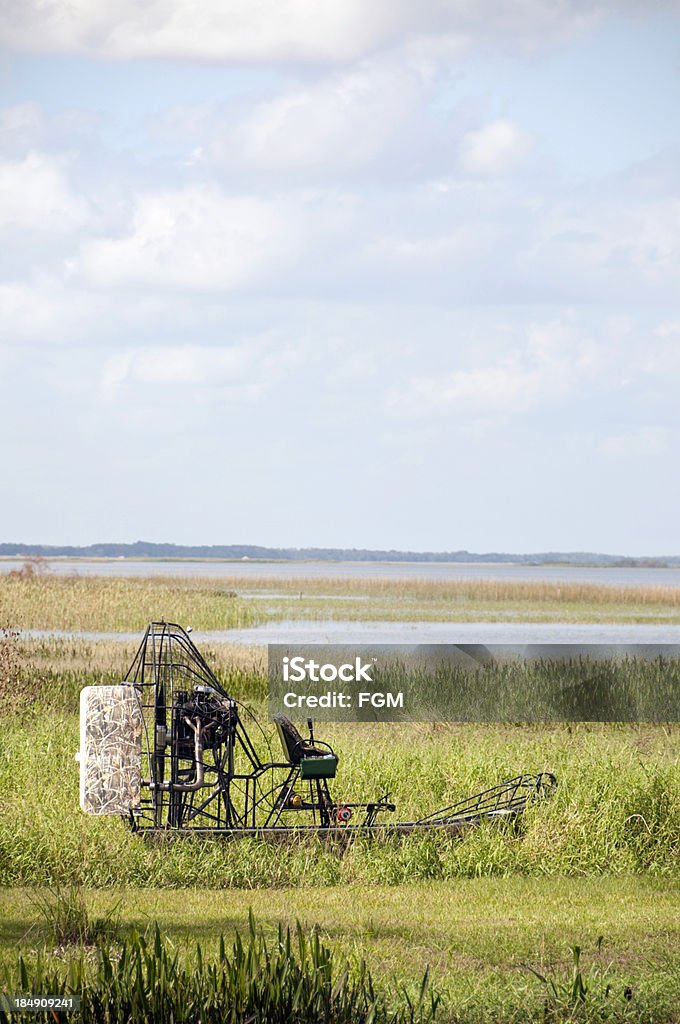 Everglades AIrboat Small airboat moored on the edge of the Everglades Airboat Stock Photo