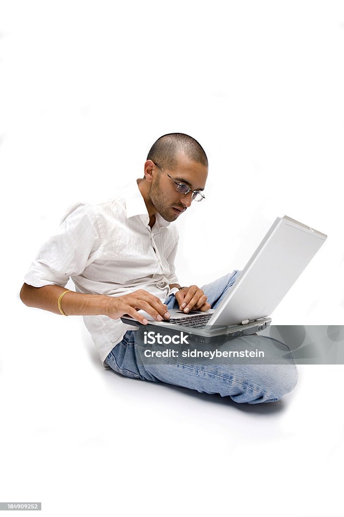 Indian Tablet PC Man Young Indian man using modern professional tablet PC. Canon 1Ds Mark 2 file Sparse Stock Photo