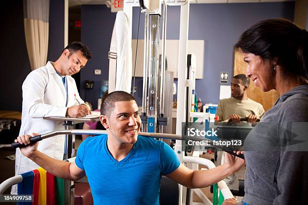 People At Physical Therapy With Therapist Stock Photo - Download Image Now - 20-29 Years, 30-39 Years, 50-59 Years