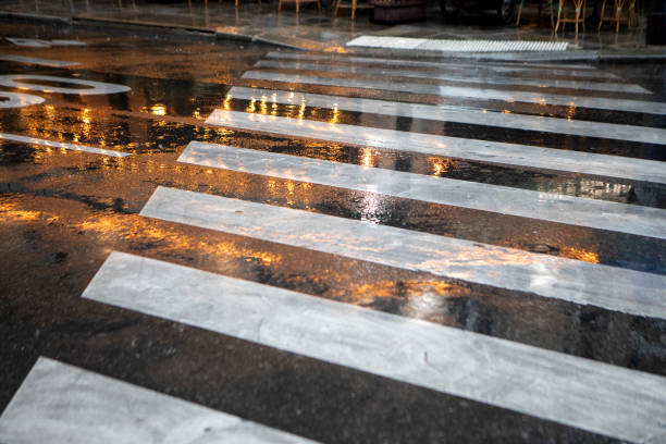 istock Lights reflected in a wet zebra crossing 1849098098