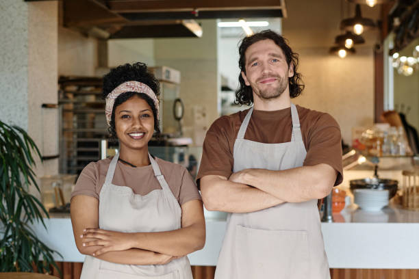 istock Happy Biracial Bakery Workers Confidently Posing Together 1849099154