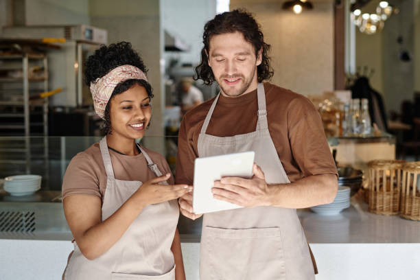 istock Cafe Employees Having Professional Conversation at Workplace 1849101276