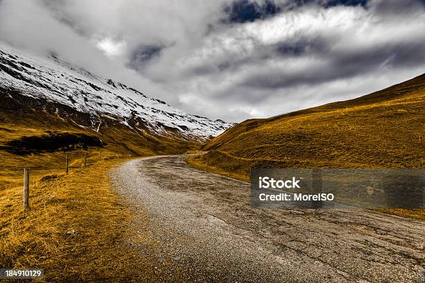 Country Dirt Road In The Alps Stock Photo - Download Image Now - Dirt Road, Mountain, Blue