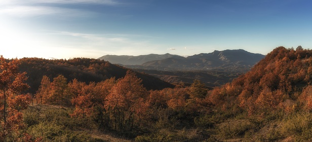 A panorama mountain and forest landscape in fall foliage colours in the hills of Abruzzo