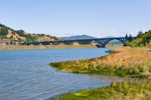 This view along the Rogue River at Gold Beach in Oregon offers fishermen as well as campers exciting outings.