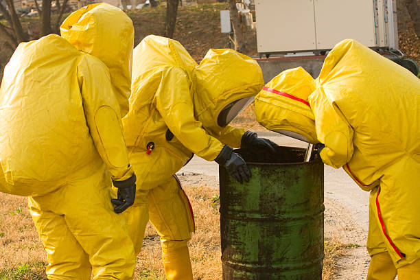 Collecting hazardous material Collecting hazardous material biohazard cleanup stock pictures, royalty-free photos & images