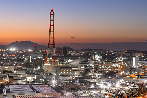 Cityscape of the Kitakyushu factory area at dusk seen from a hill