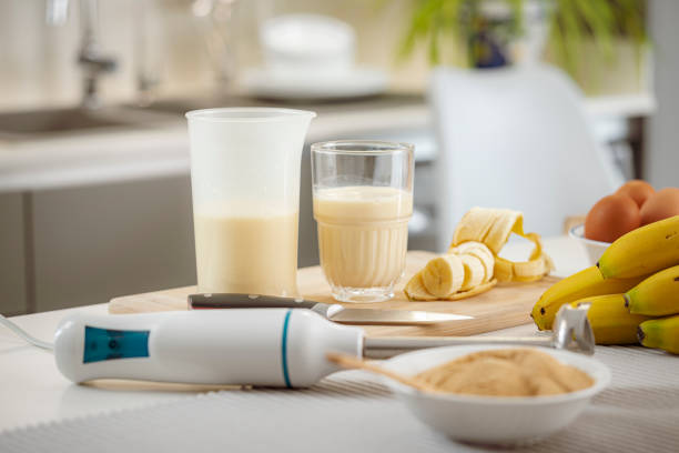 Freshly blended banana smoothie on kitchen counter