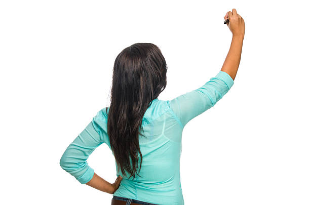 istock Rear view of young woman writing 184911679