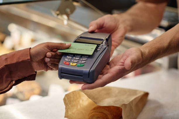 istock Bakery Visitor Paying for Pastry with Plastic Card 1849119180
