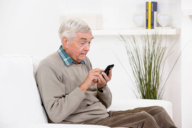 istock Senior Man Reading A Shocking Message On His Smart Phone 184912203