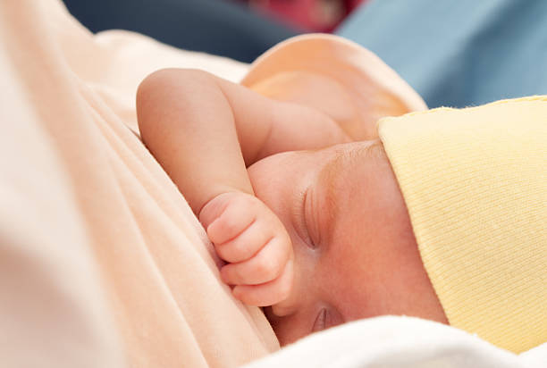 Premature baby born at 25th week of pregnancy breastfeeding.