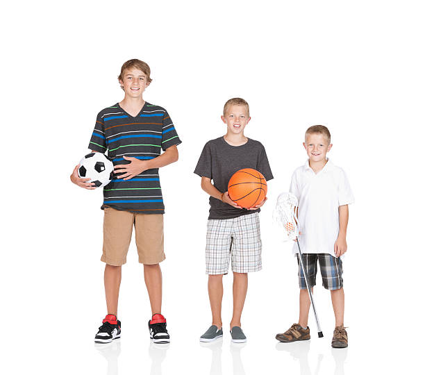 istock Three boys holding sports equipments 184912485