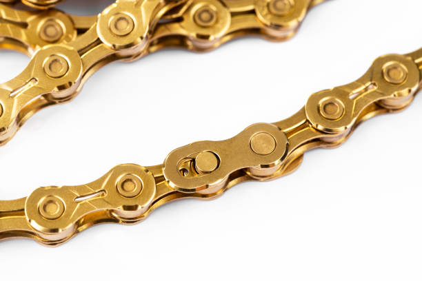 bicycle gold chain closeup, macro chain connector or missing link for quick link connection stock photo