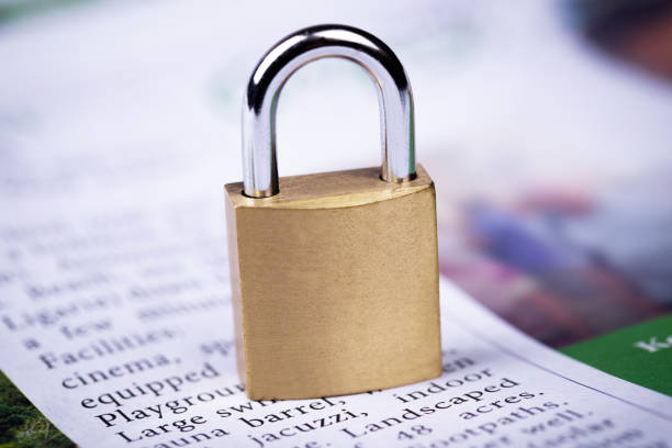 newspaper with metal lock closeup stock photo