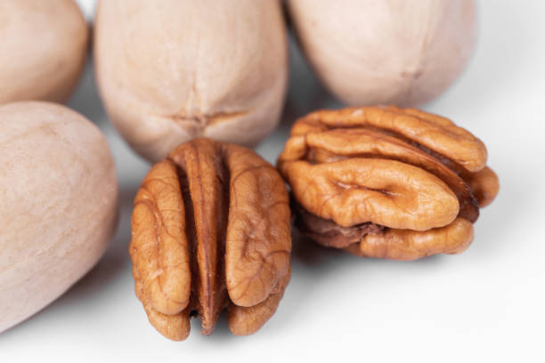 Pecans nuts macro on a white background stock photo