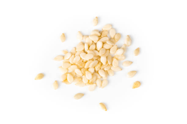 sesame seeds macro, isolated on white background closeup stock photo