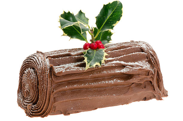 Chocolate Yule log Chocolate Yule log - studio shot with a white background christmas cake stock pictures, royalty-free photos & images