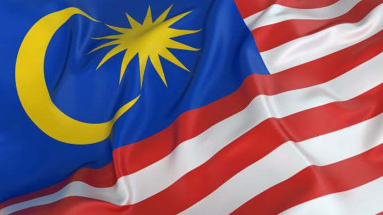 Malaysia Flag, Jalur Gemilang waving with the background of Malaysian rainforest trees.Malaysia Flag, Jalur Gemilang waving with the background of lake and Malaysian rainforest trees.