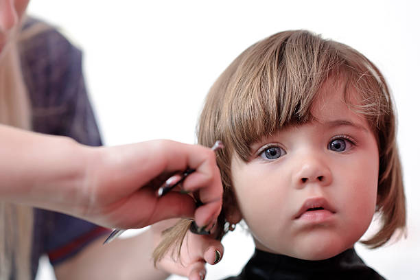 istock little girl haircut 184913041
