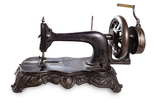 Vintage cast iron sewing machine isolated