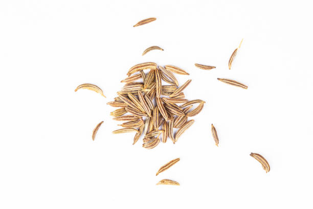 cumin, caraway seeds macro isolated on white background closeup stock photo