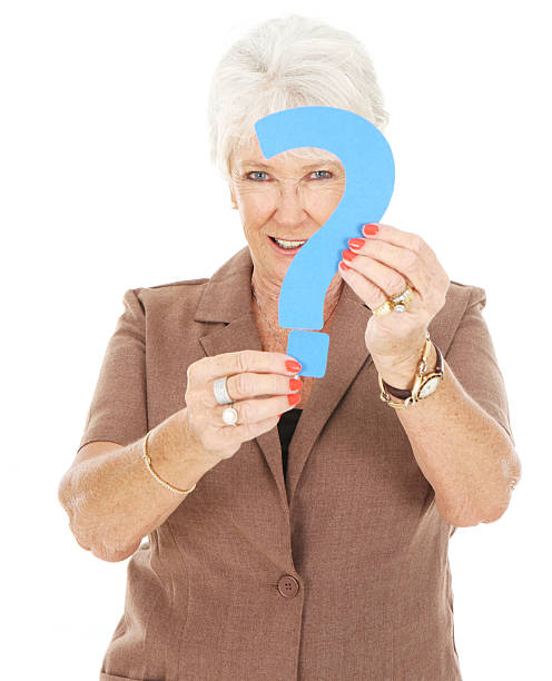 istock Senior woman holding a question mark 184913447
