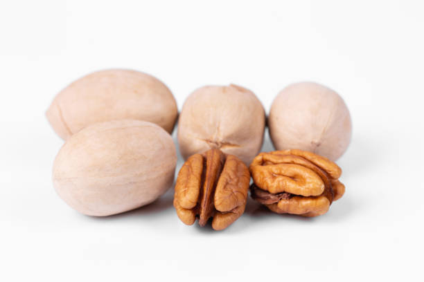 Pecans nuts on a white background stock photo