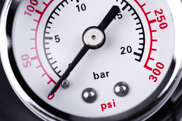 air compressor with bar and psi manometer close-up macro. Pressure gauge measurement. stock photo