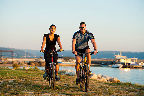 istock Young pair cycling by the sea 184914040