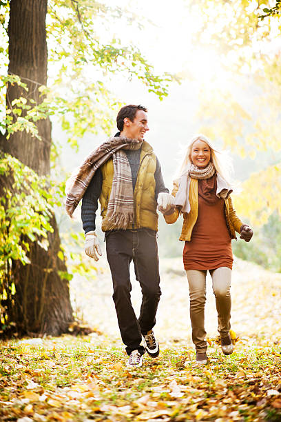 istock Beautiful smiling couple running in the park. 184914150
