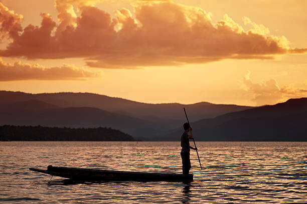 istock Man Paddling a Traditional Canoe 184914370