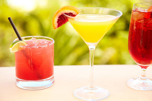 Close up of three cocktails at outdoor bar
