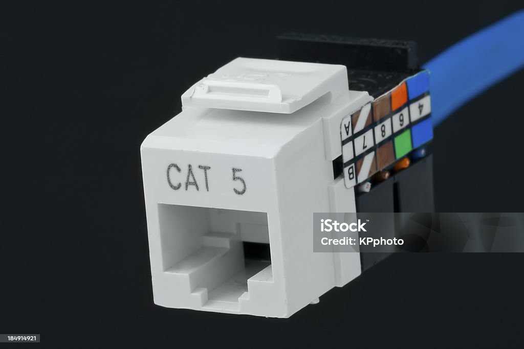 network plug for wall outlet cat 5 a rj-45 jack. Electrical Outlet Stock Photo
