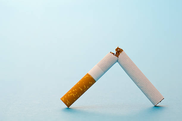 Broken cigarette stock photo
