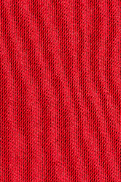 Red nylon mesh over neoprene macro Neoprene is a synthetic rubber material used to cover surfaces (including people) for waterproofing. It is often covered on one or both sides by a nylon fabric layer, such as in this image (the black neoprene is semi-visible in the holes between the nylon stitches when viewed at 100%). neoprene photos stock pictures, royalty-free photos & images