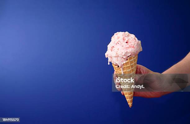 Strawberry Ice Cream Cone On Blue With Space For Copy Stock Photo - Download Image Now