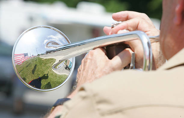 Reflection through a bugle Reflections of the american flag through a bugle bugling photos stock pictures, royalty-free photos & images